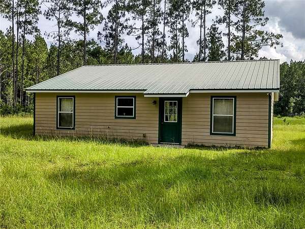 50 Acres of Recreational Land with Home for Sale in Chiefland, Florida