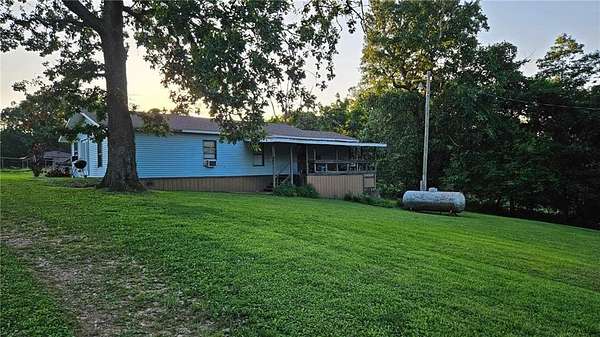 3 Acres of Residential Land with Home for Sale in Gravette, Arkansas