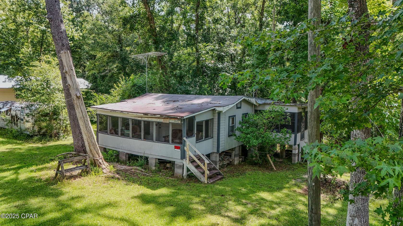 0.53 Acres of Residential Land with Home for Sale in Wewahitchka, Florida