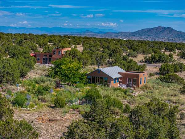 9.9 Acres of Residential Land with Home for Sale in Cerrillos, New Mexico