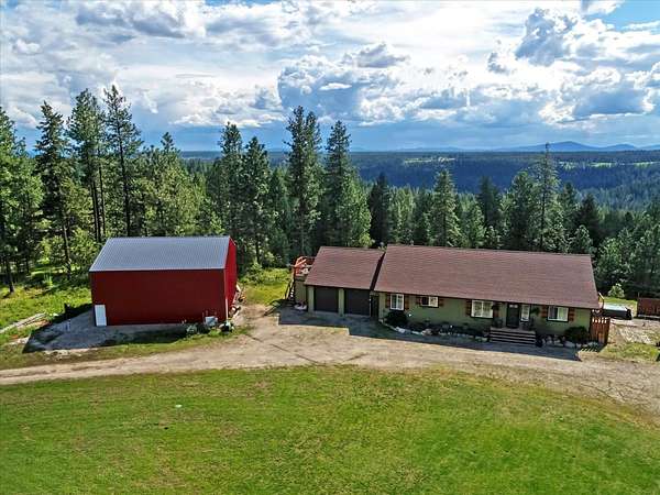 11.1 Acres of Recreational Land with Home for Sale in Elk, Washington