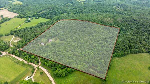 40.7 Acres of Land with Home for Sale in Macks Creek, Missouri