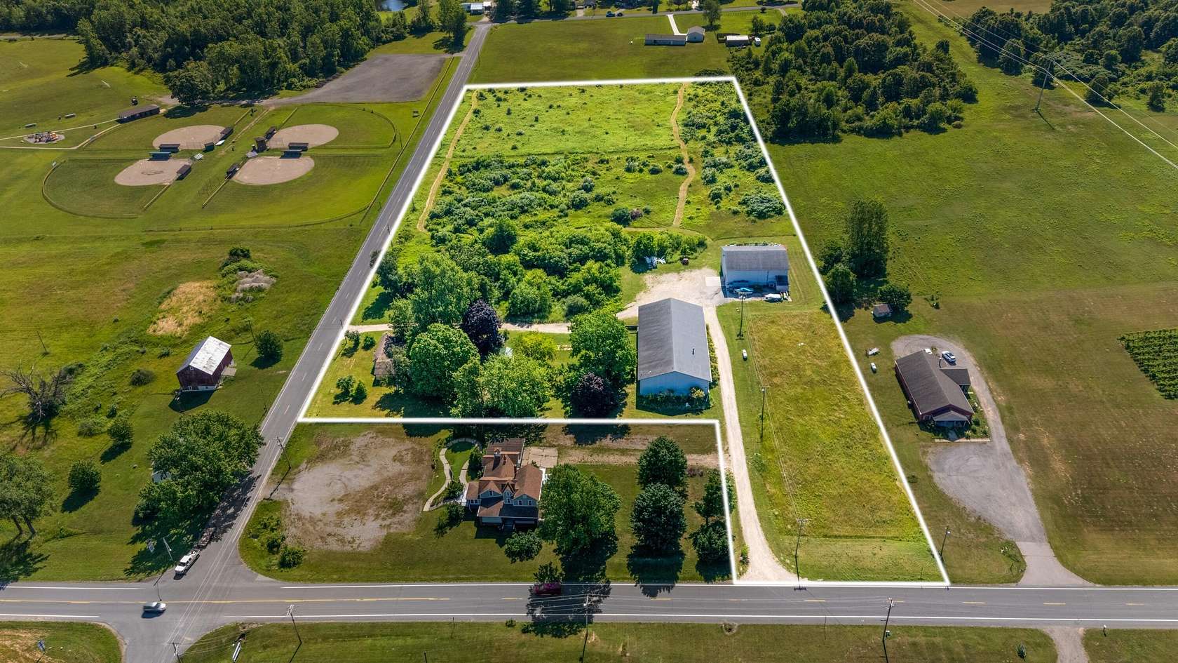 11.4 Acres of Improved Commercial Land for Sale in Coloma, Michigan