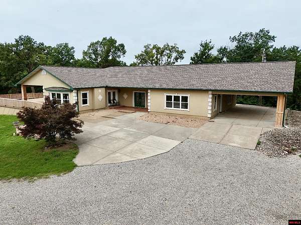 5.6 Acres of Residential Land with Home for Sale in Mountain Home, Arkansas