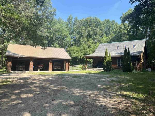 15.4 Acres of Land with Home for Sale in Houghton Lake, Michigan