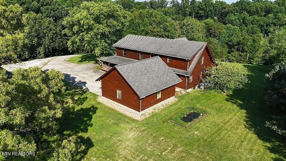 4.9 Acres of Residential Land with Home for Sale in Friendsville, Tennessee