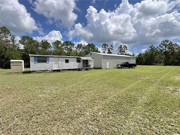5 Acres of Land with Home for Sale in Osteen, Florida