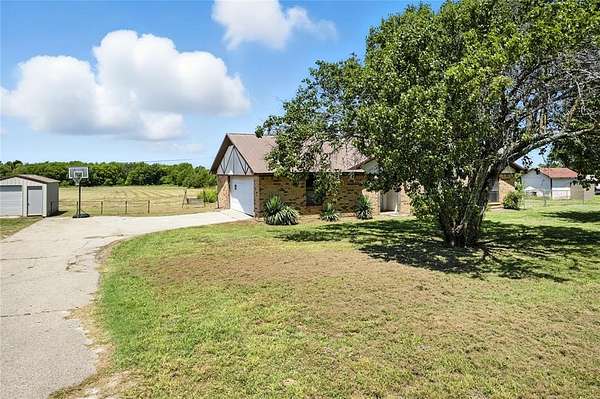 5 Acres of Residential Land with Home for Sale in Cooper, Texas