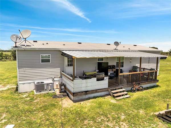 3 Acres of Residential Land with Home for Sale in Weirsdale, Florida