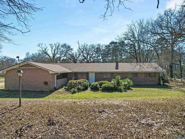 4 Acres of Residential Land with Home for Sale in Avinger, Texas