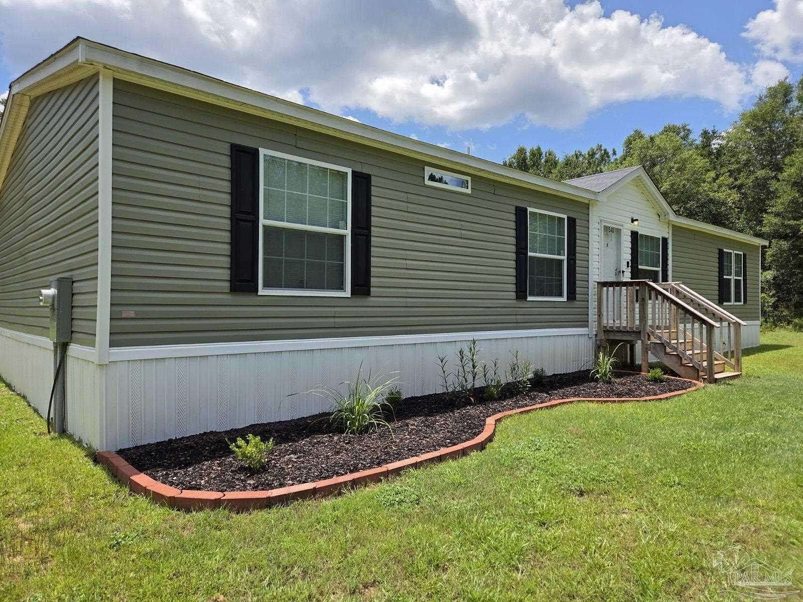 2 Acres of Residential Land with Home for Sale in Holt, Florida