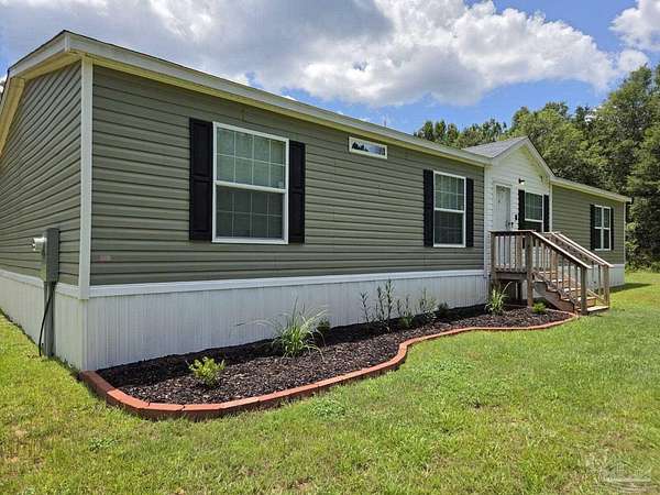 2 Acres of Residential Land with Home for Sale in Holt, Florida