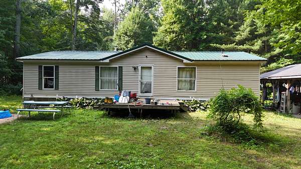 10 Acres of Land with Home for Sale in Wellston, Michigan