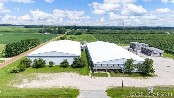 11.9 Acres of Improved Commercial Land for Sale in Belding, Michigan