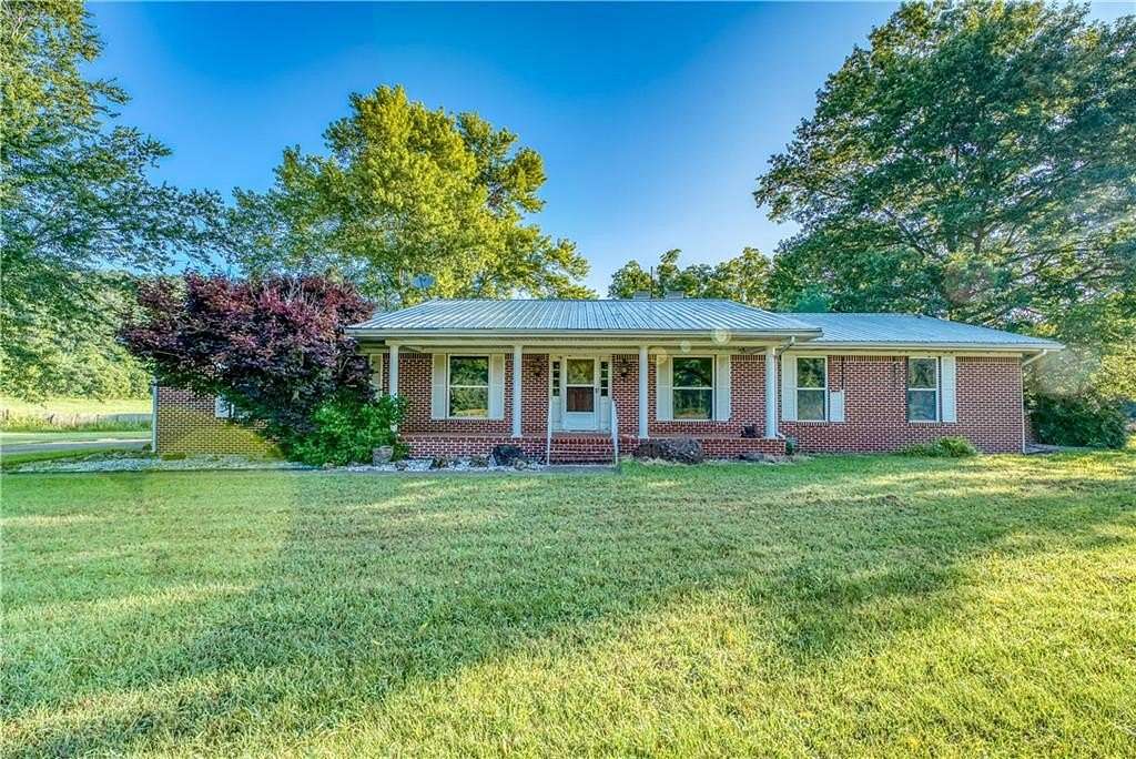 228 Acres of Land with Home for Sale in Green Forest, Arkansas