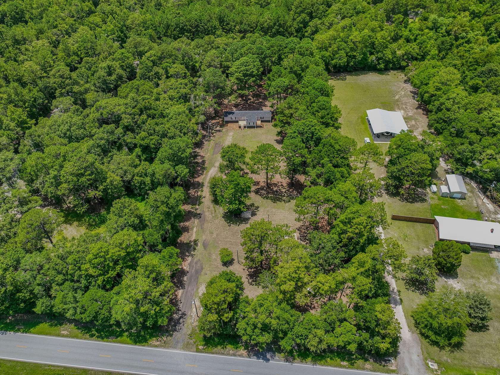 2.4 Acres of Residential Land with Home for Sale in Baker, Florida