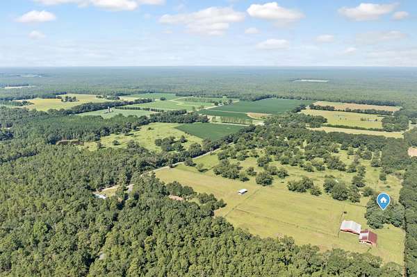 14.6 Acres of Land with Home for Sale in Baker, Florida