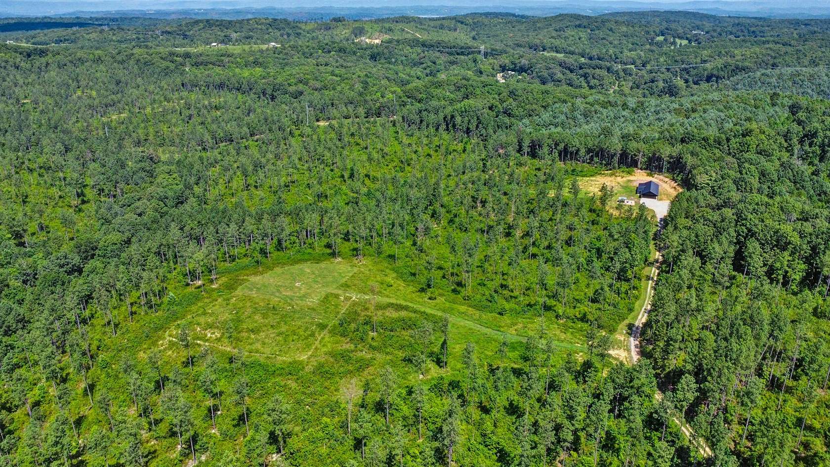 61.9 Acres of Land with Home for Sale in Ten Mile, Tennessee