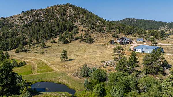 57.3 Acres of Recreational Land with Home for Sale in Livermore, Colorado