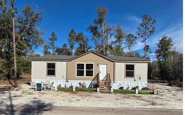 10 Acres of Residential Land with Home for Sale in Live Oak, Florida