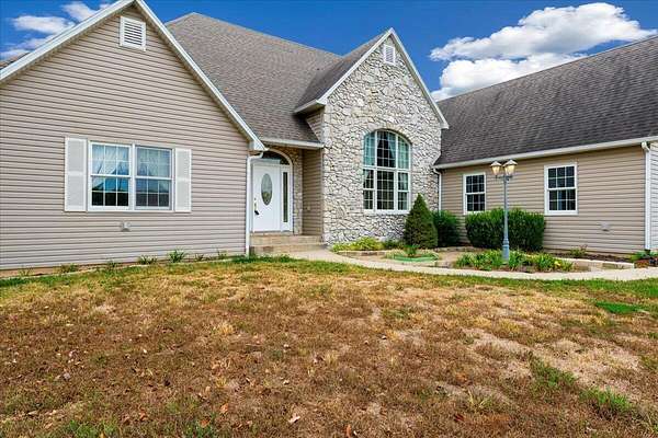 27.6 Acres of Agricultural Land with Home for Sale in Pleasant Hope, Missouri