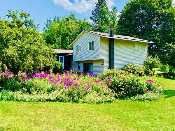 11.5 Acres of Recreational Land with Home for Sale in Lupton, Michigan