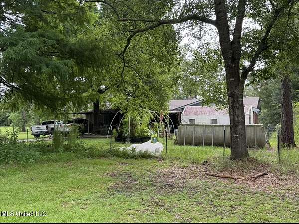 10.5 Acres of Land with Home for Sale in Saucier, Mississippi