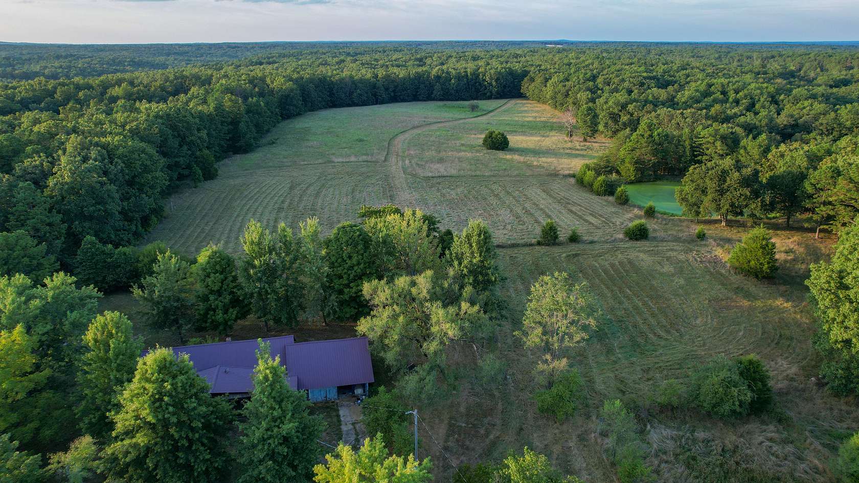 130 Acres of Land with Home for Sale in Raymondville, Missouri