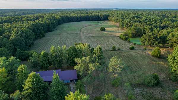 130 Acres of Land with Home for Sale in Raymondville, Missouri