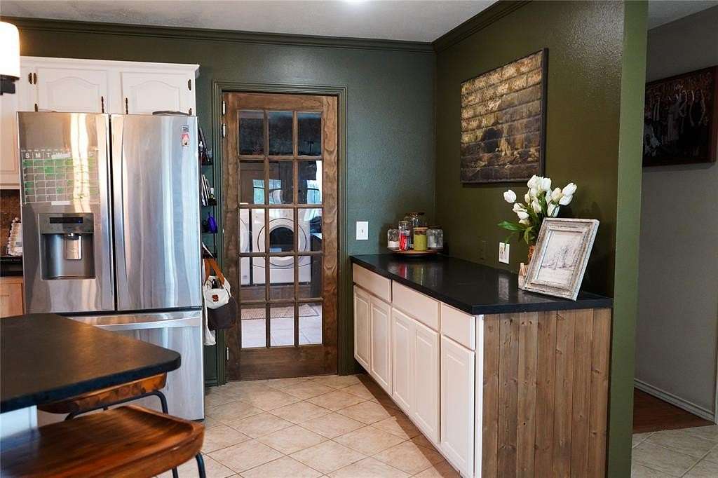 5 Acres of Residential Land with Home for Sale in Paris, Texas