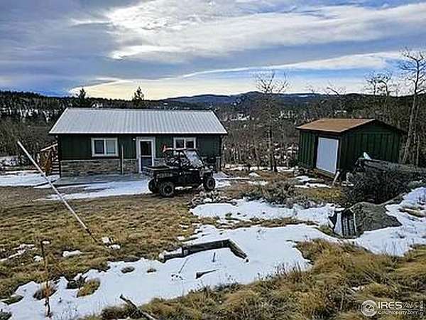 2.3 Acres of Residential Land with Home for Sale in Red Feather Lakes, Colorado