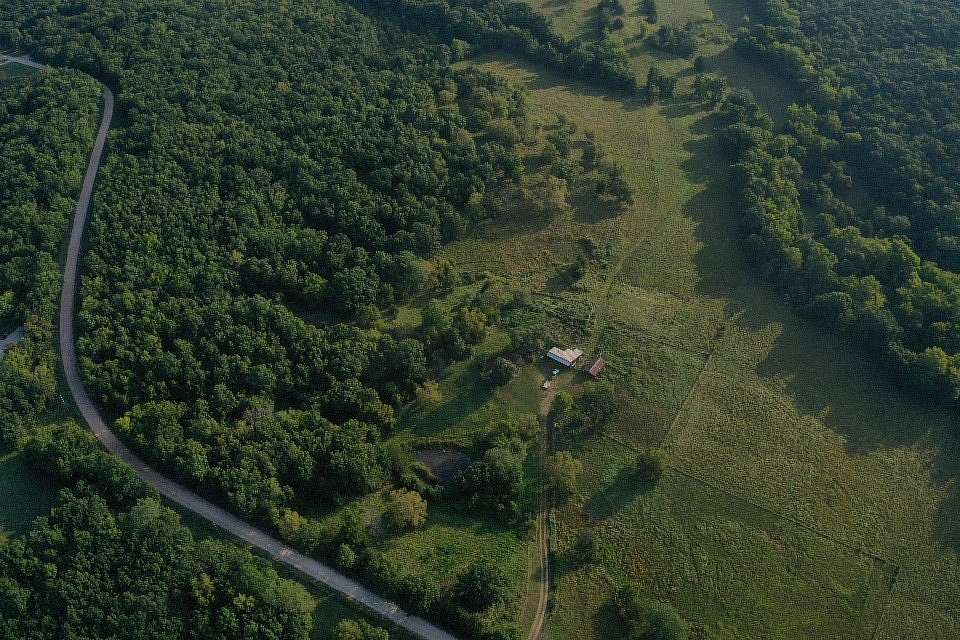 242 Acres of Land with Home for Sale in Cole Camp, Missouri