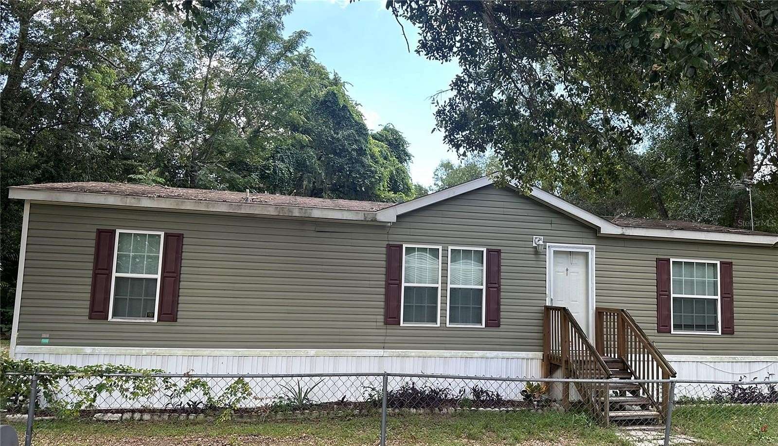 2.2 Acres of Residential Land with Home for Sale in Leesburg, Florida