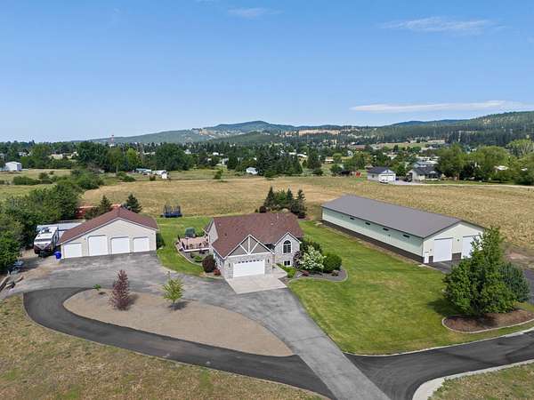 5.1 Acres of Residential Land with Home for Sale in Otis Orchards, Washington