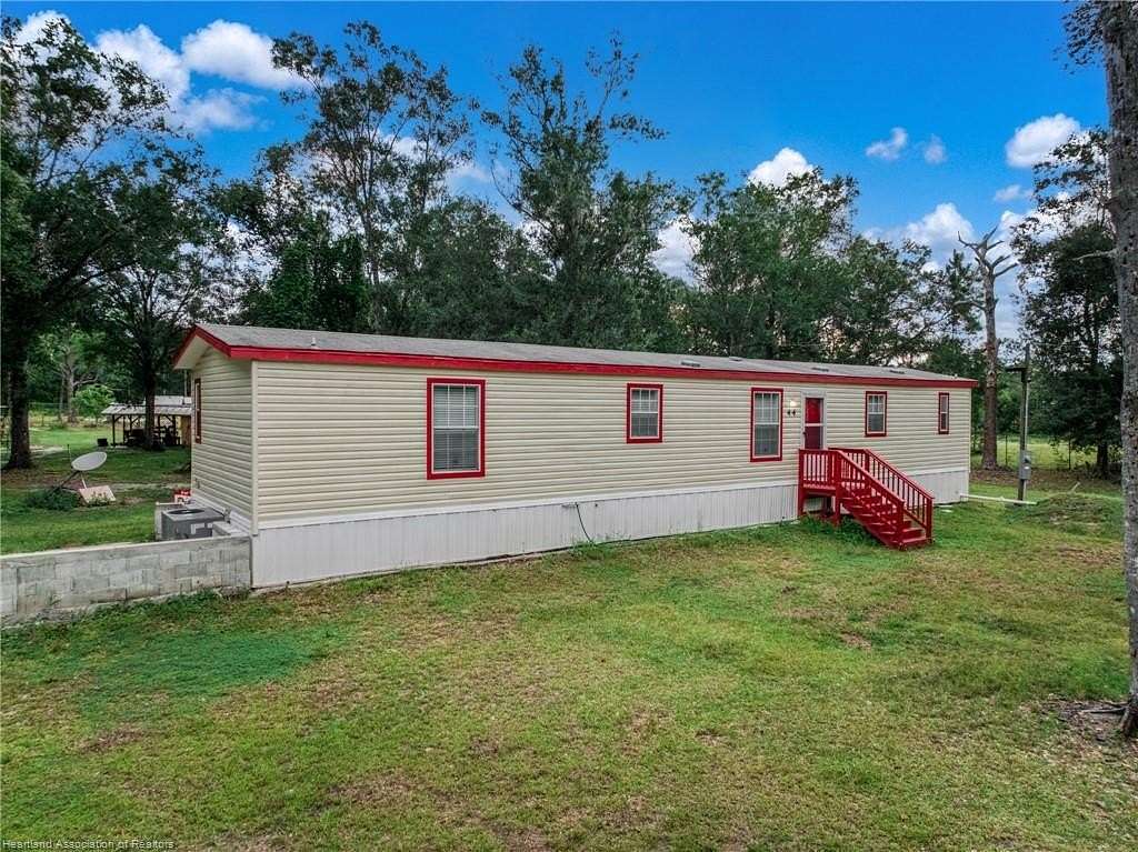 2.5 Acres of Land with Home for Sale in Frostproof, Florida