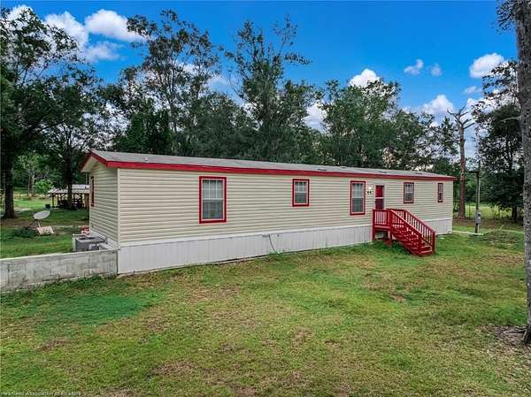 2.5 Acres of Land with Home for Sale in Frostproof, Florida