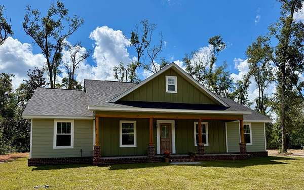 4.3 Acres of Residential Land with Home for Sale in Live Oak, Florida