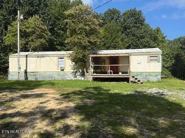 6.6 Acres of Residential Land with Home for Sale in Sunbright, Tennessee