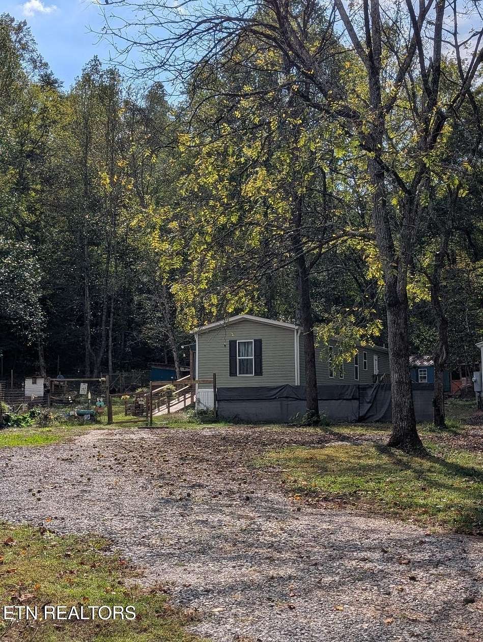 2.75 Acres of Residential Land with Home for Sale in Friendsville, Tennessee