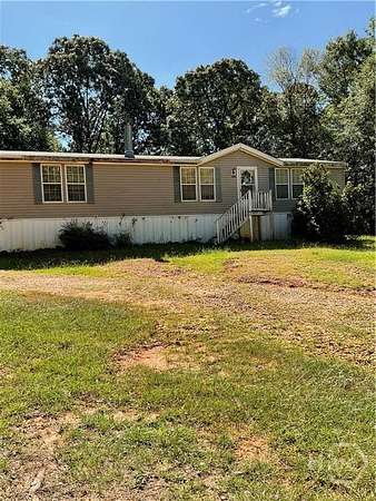 12.5 Acres of Land with Home for Sale in Dewy Rose, Georgia