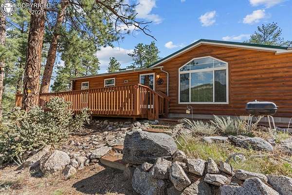 10.6 Acres of Land with Home for Sale in Texas Creek, Colorado