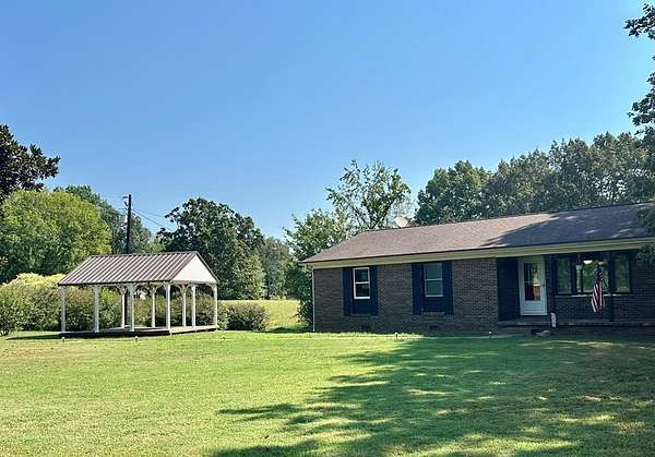 4.6 Acres of Residential Land with Home for Sale in Puryear, Tennessee