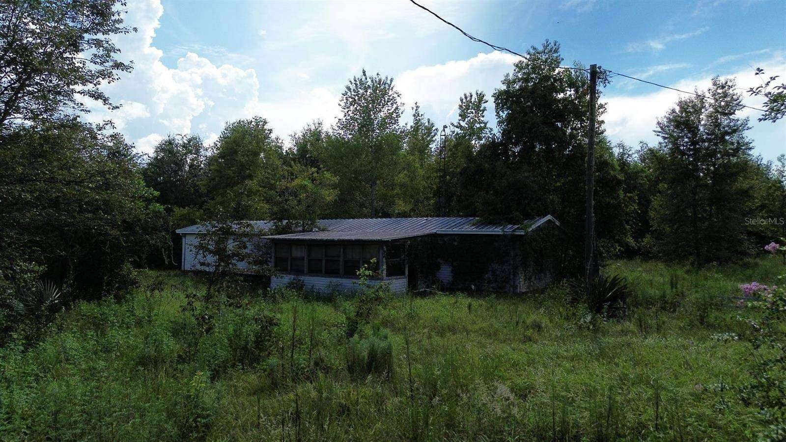 5.79 Acres of Residential Land with Home for Sale in Weirsdale, Florida