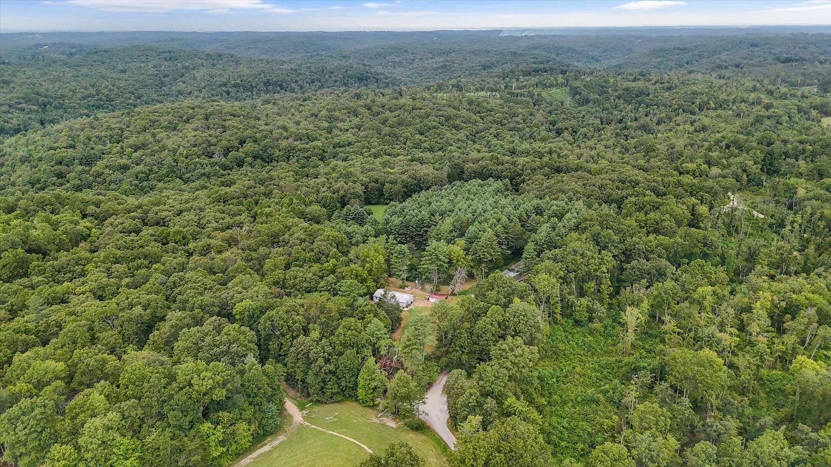 19.6 Acres of Land with Home for Sale in Lancing, Tennessee