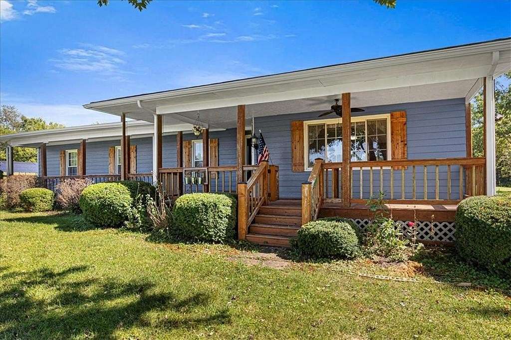 13.3 Acres of Land with Home for Sale in Lathrop, Missouri