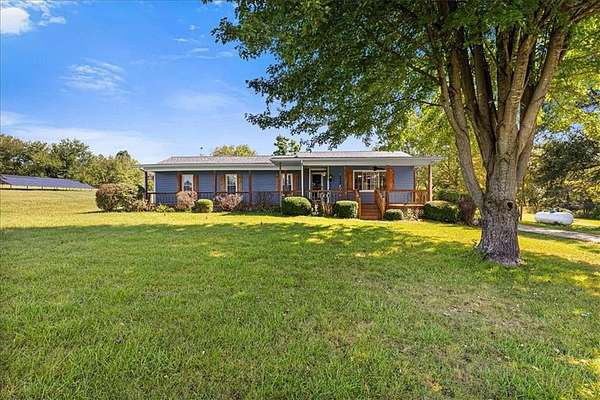 13.3 Acres of Land with Home for Sale in Lathrop, Missouri