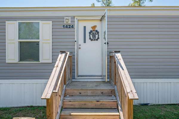 1.53 Acres of Residential Land with Home for Sale in Baker, Florida