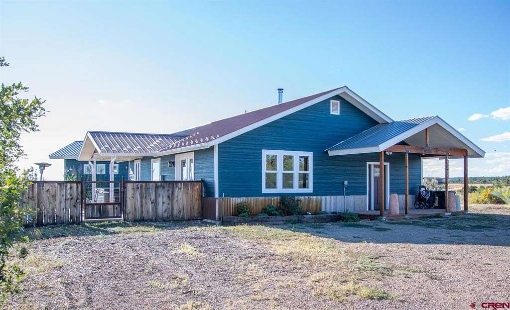 5 Acres of Residential Land with Home for Sale in Mancos, Colorado