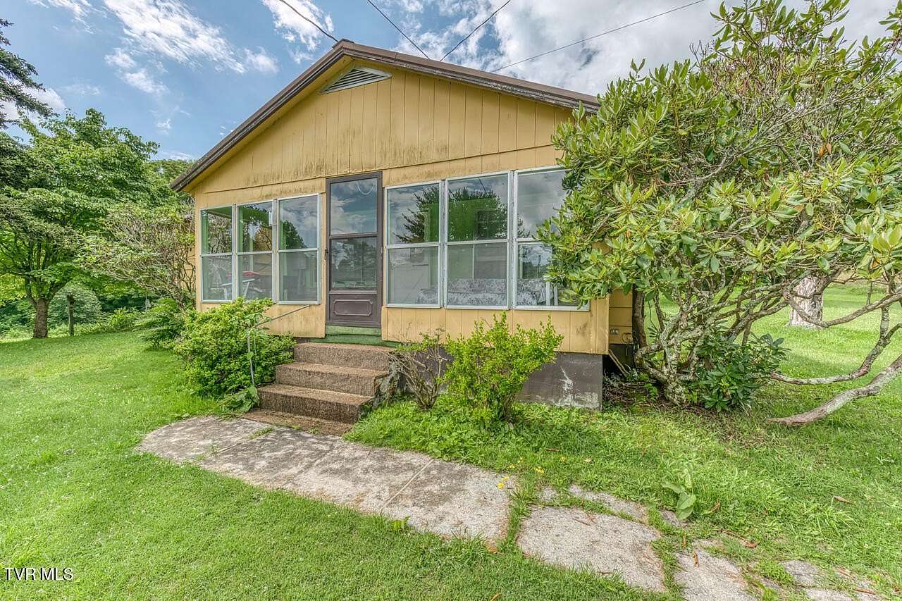 5.22 Acres of Residential Land with Home for Sale in Roan Mountain, Tennessee