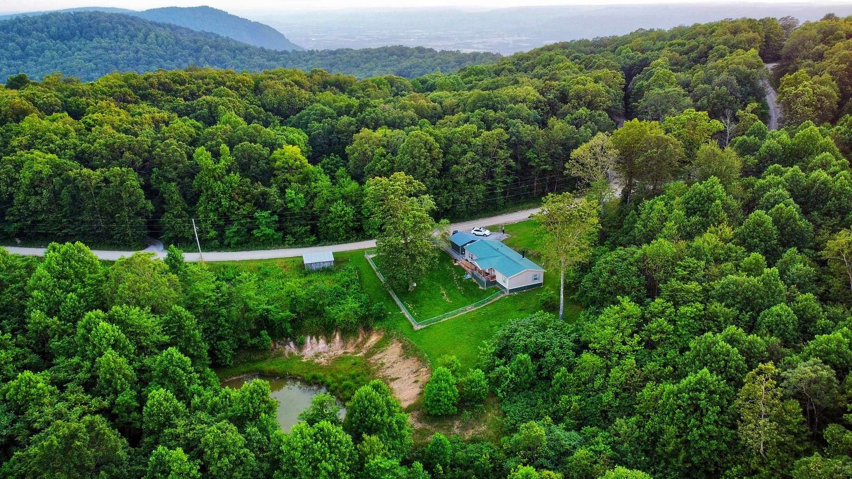 10.7 Acres of Land with Home for Sale in Spring City, Tennessee